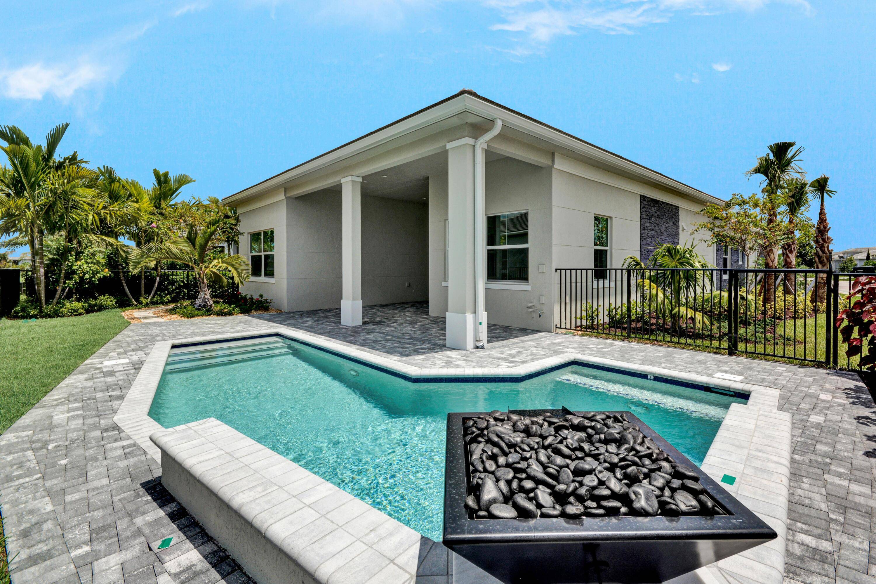 Private Pool The Jesalin's welcoming covered entry flows into the extended foyer with tray ceilings, revealing the expansive great room and bright dining room with tray ceilings throughout, and desirable ...