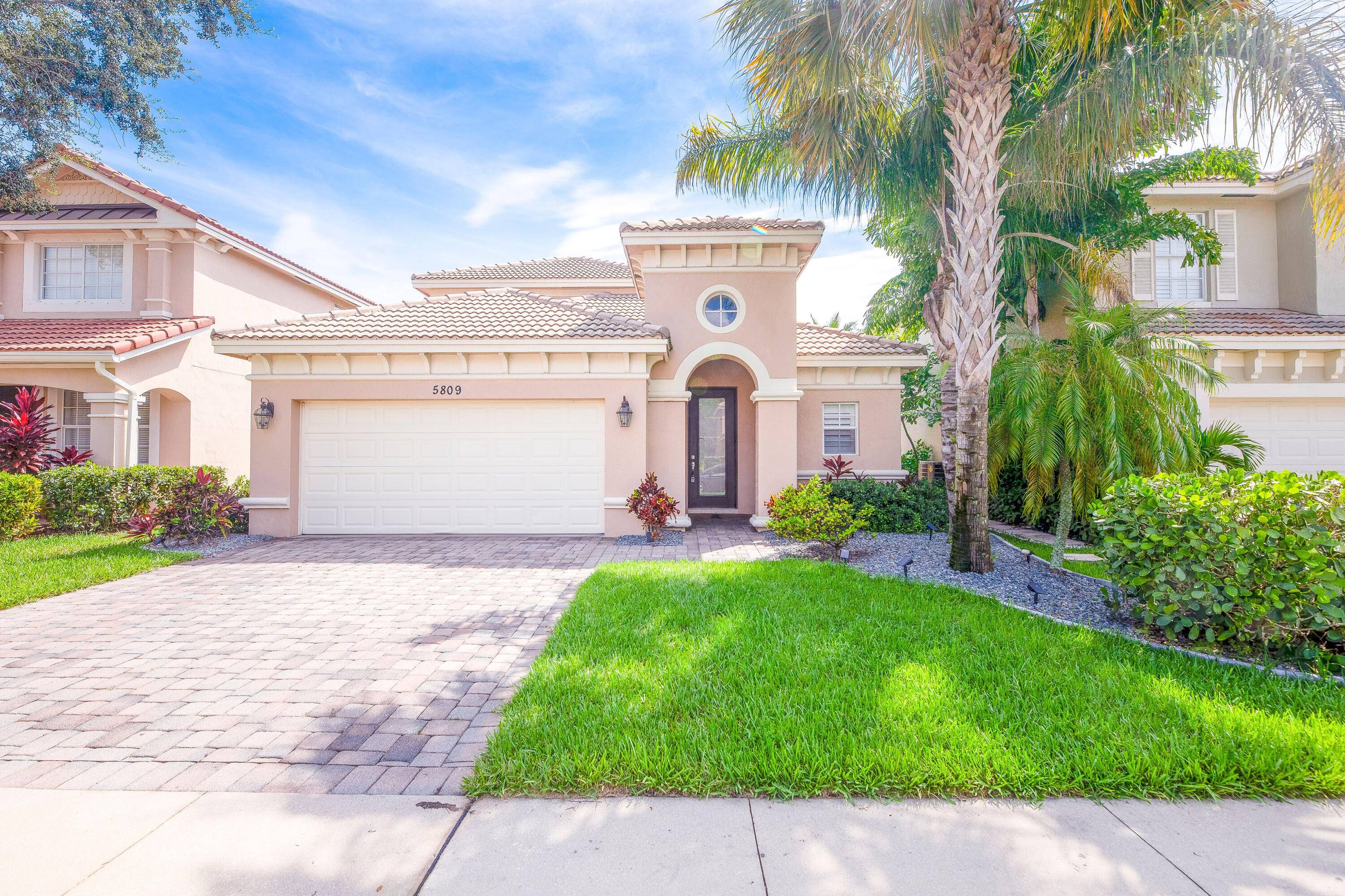 Wonderfully maintained 4 bedroom, 3 bathroom, 2 car garage with loft den game room in The Oaks at Hobe Sound.