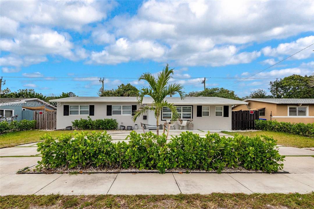 Beautifully updated 4 bedroom, 3 bath home featuring porcelain tile throughout and completely remodeled bathrooms with modern finishes.