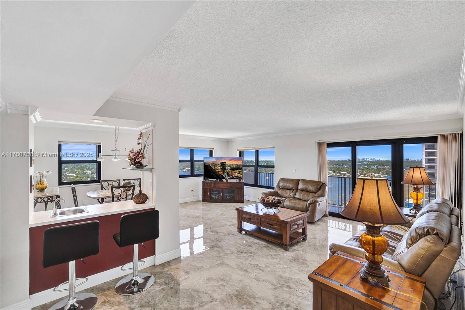 SPECTACULAR CORNER UNIT WITH WRAPAROUND WATER VIEWS THAT WILL TAKE YOUR BREATH AWAY !