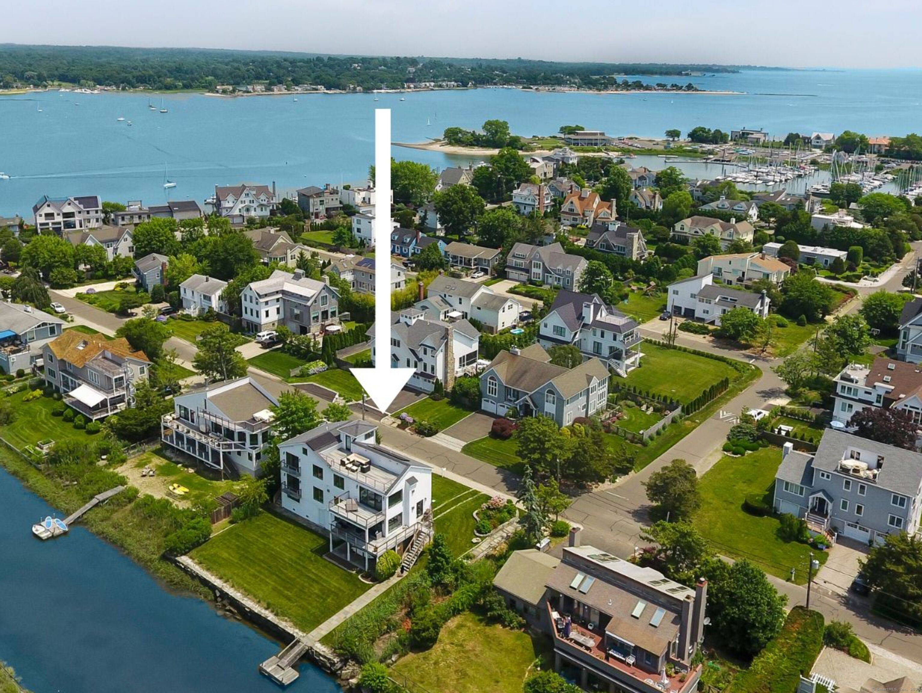Experience the ultimate blend of waterfront living luxurious coastal design at 24 Spriteview Avenue on Saugatuck Island.