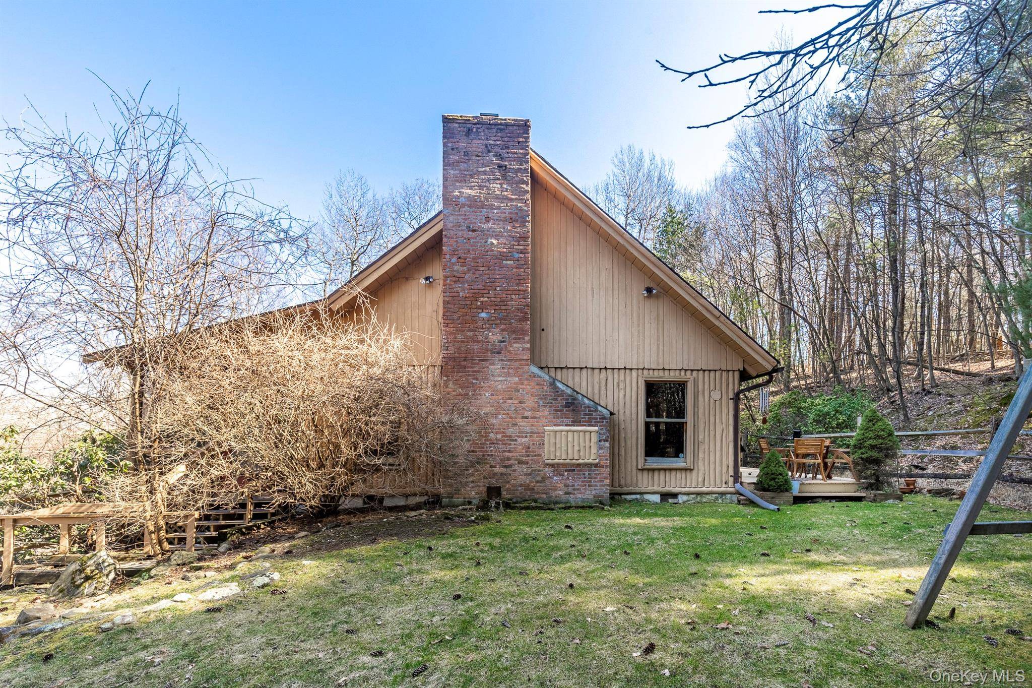 79 Torre Rock Rd. in Red Hook NY is a charming Cape Cod home tucked quietly on 12.