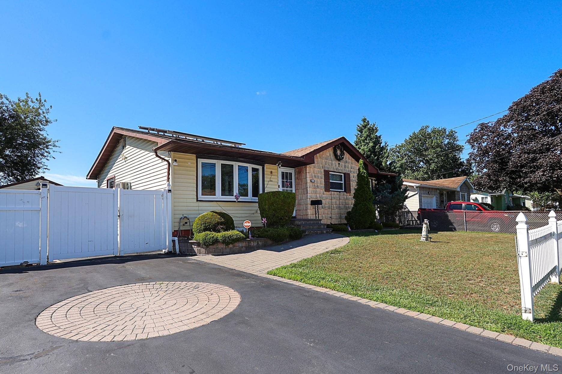 This beautiful ranch style home features generous sized rooms with ample closets, filled with natural light and polished wood floors.