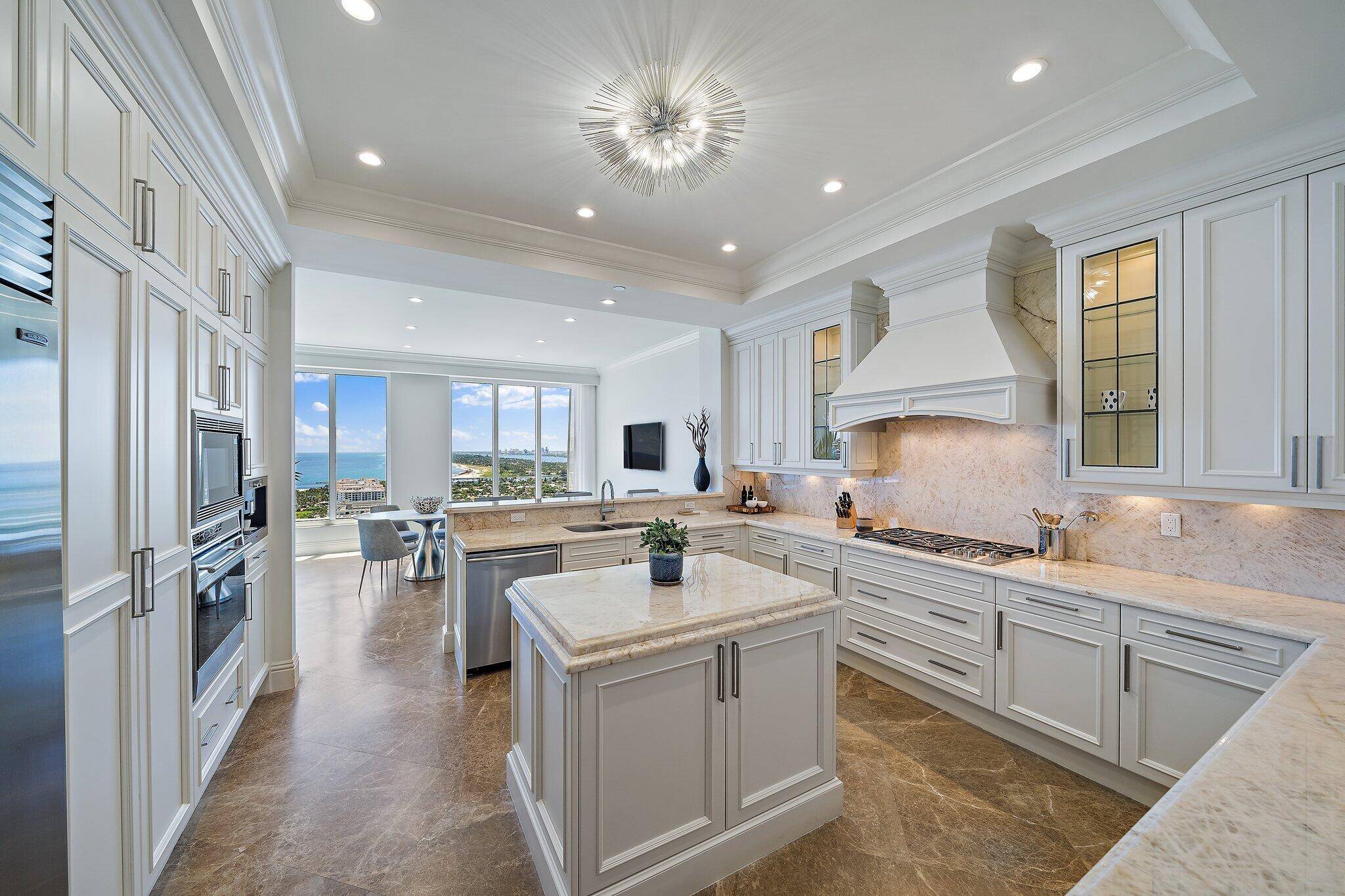 Steps from the beach, this Lower Penthouse Ritz Carlton Residence is beautifully renovated, with 2 private balconies, den bonus room and wet bar.