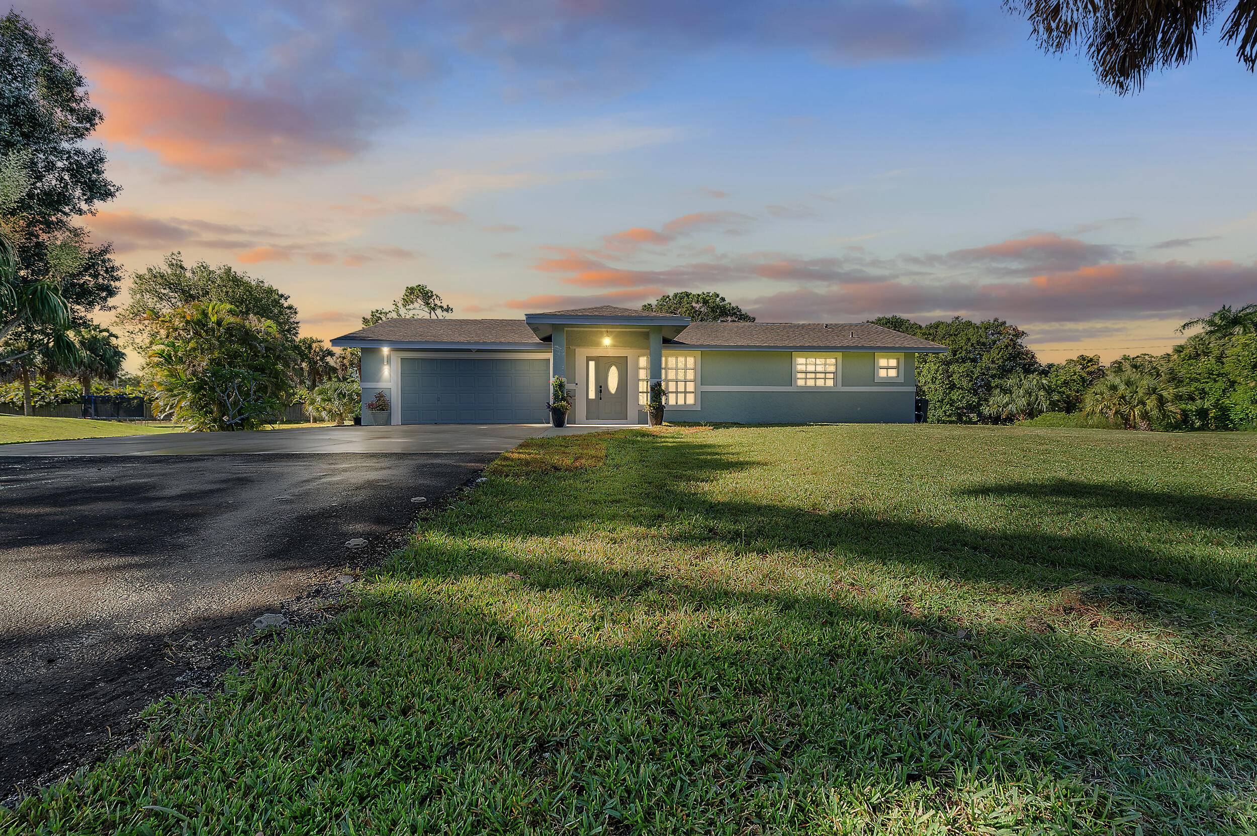 Welcome to this beautifully remodeled 3 bedroom, 3 bathroom home with a two car garage, set on 1.