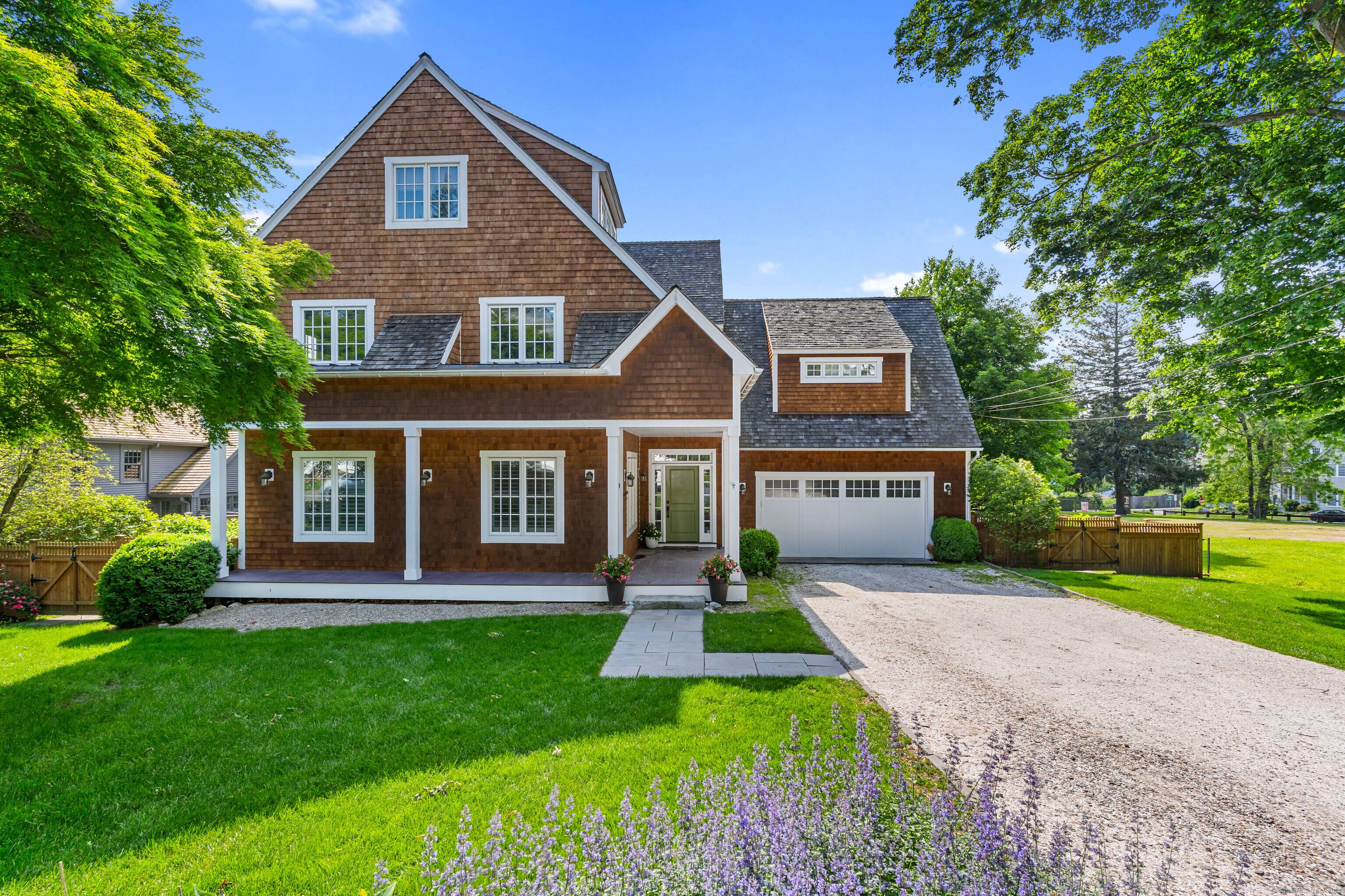 This sun filled shingle style colonial is just a block away from shops, restaurants, the Farmers market, and Five Mile River.
