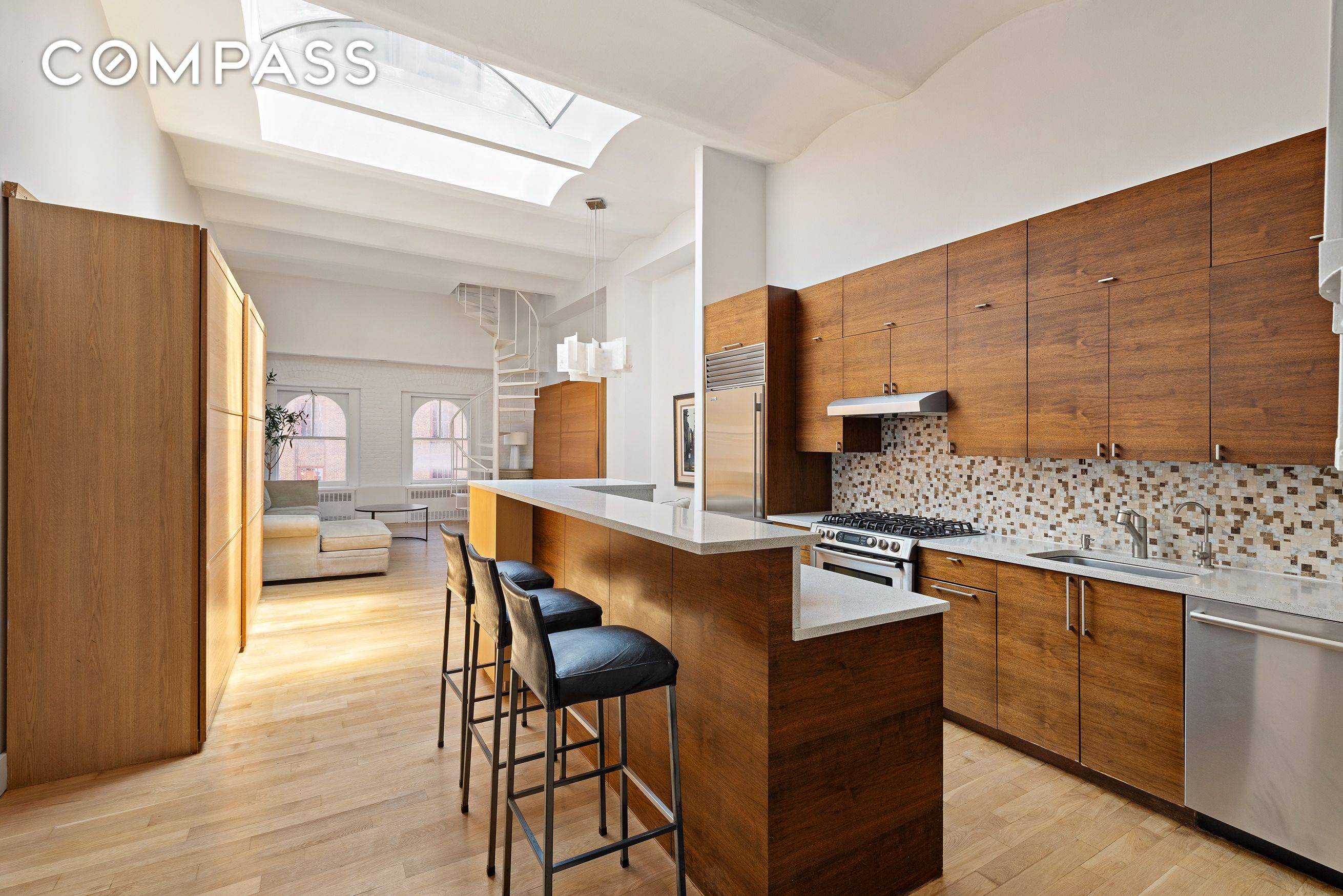 Tribeca Loft Triplex with Private Rooftop Oasis This true Tribeca loft blends historic charm with rare outdoor living across multiple levels.