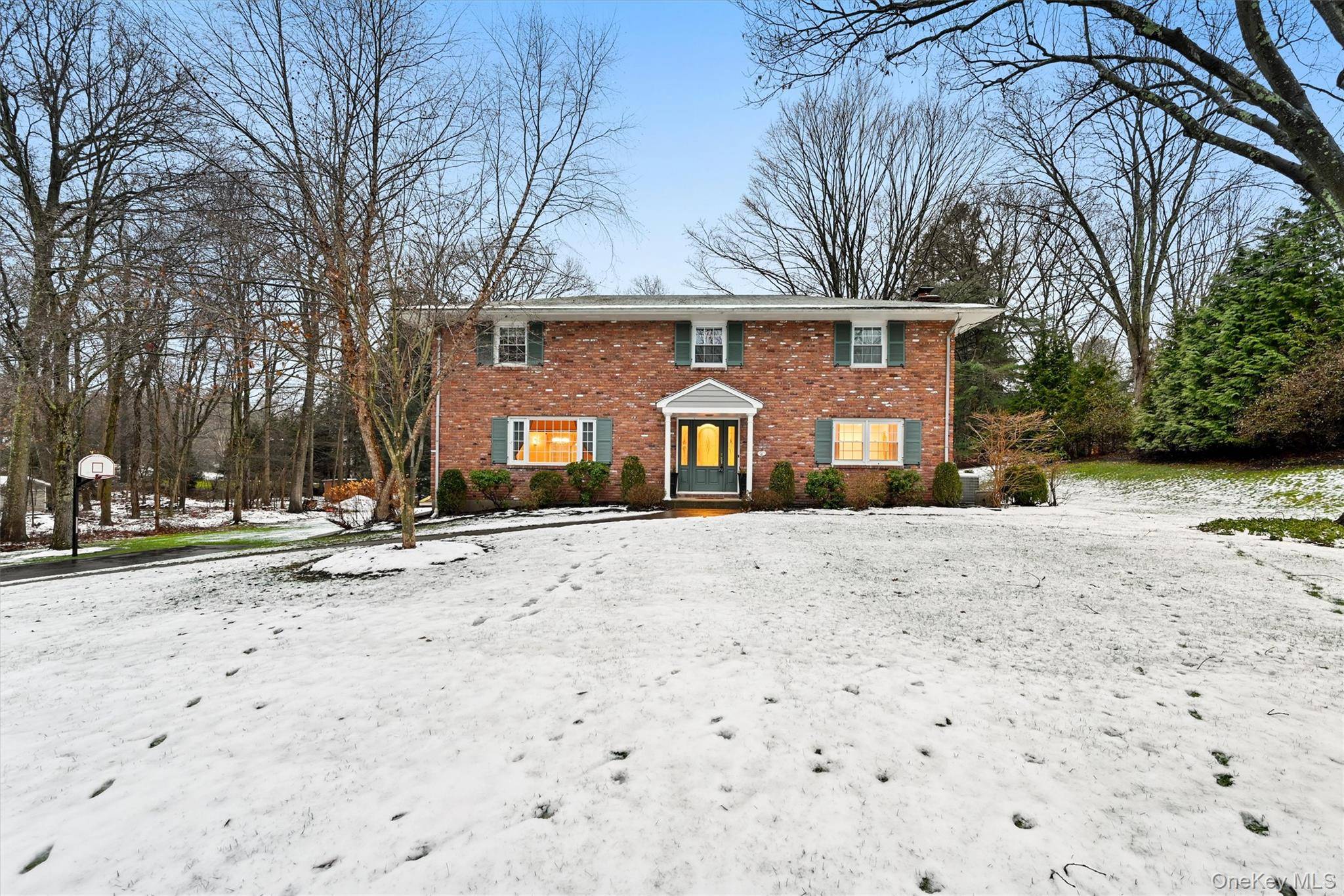 Elegant and beautiful brick colonial featuring all hardwood floors, sophisticated granite kitchen with double wall oven and a center island, all stainless steel appliances and a stunning view to the ...