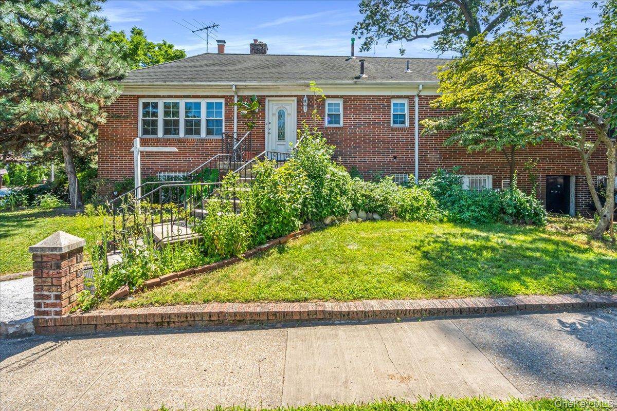 Very unique brick corner High Ranch style home in excellent Jamaica Estates Hollis location, between the Grand Central and Hillside Ave.