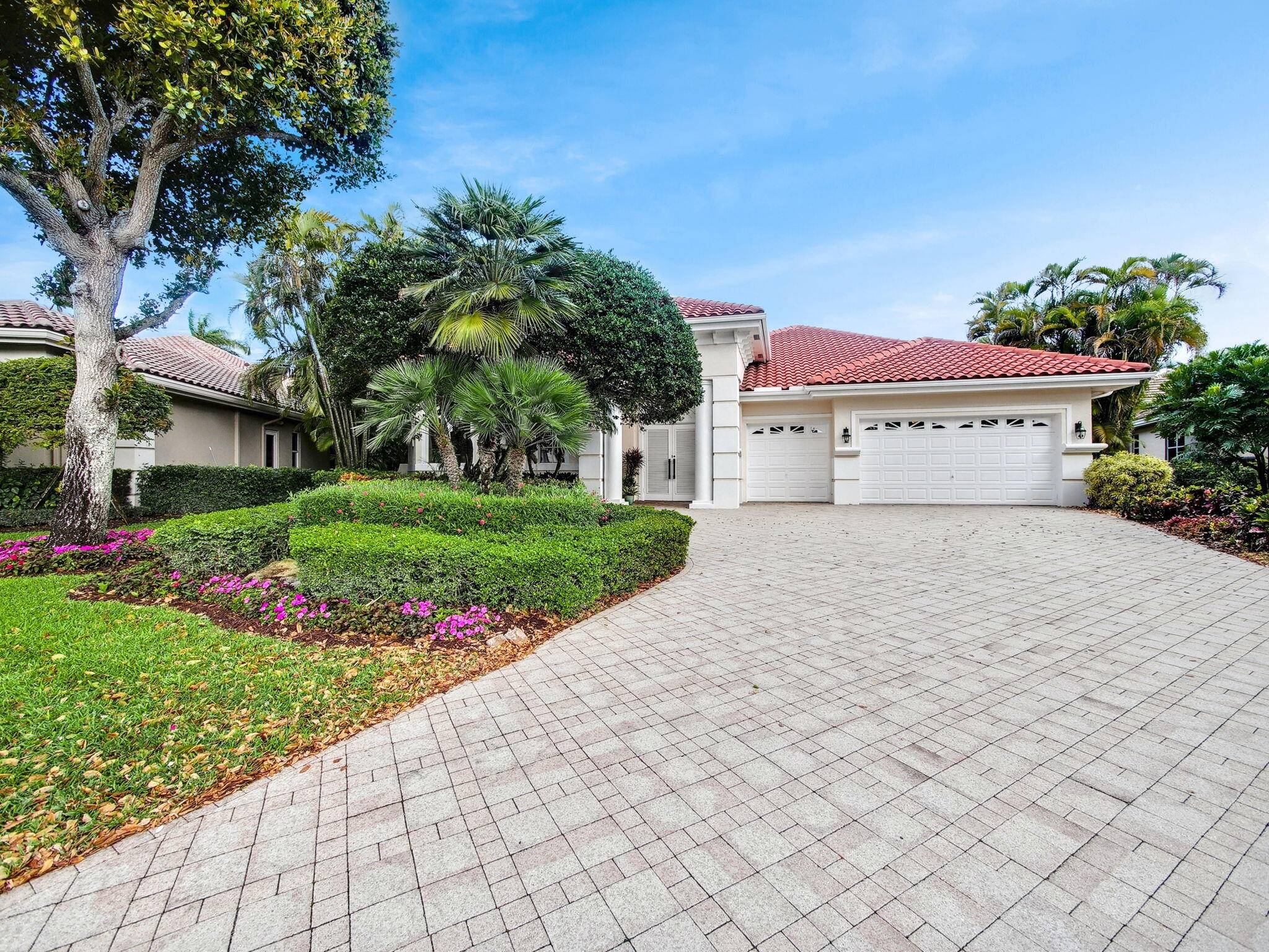STUNNING AND PRISTINE COURTYARD HOME IN THE PRESTIGIOUS NEIGHBORHOOD OF GRAND ISLE ESTATES.