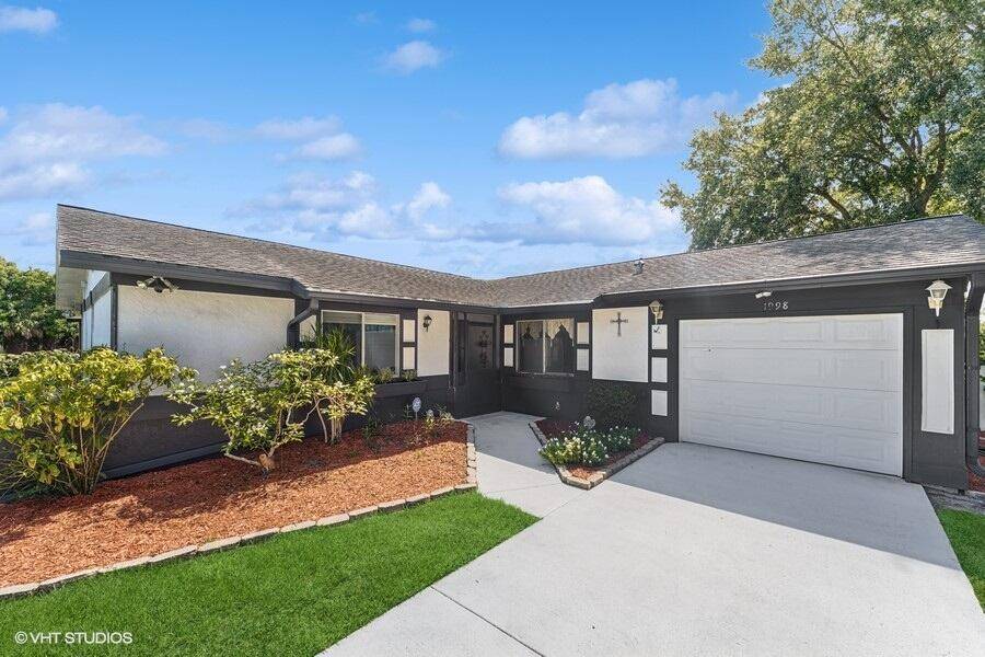 Charming 3 bedroom, 2 bath pool home with a 1 car garage situated on a spacious 0.