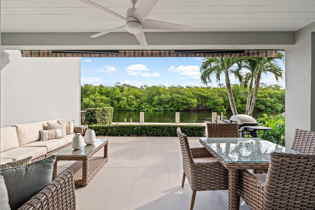 A bespoke masterpiece of contemporary design awaits within the coveted, guard gated enclave of Boca Marina Yacht Club.