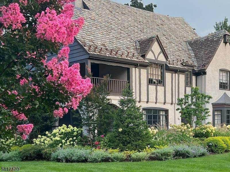 Perfectly positioned on a corner lot on premier Douglas Rd, this 5 BR, 3.