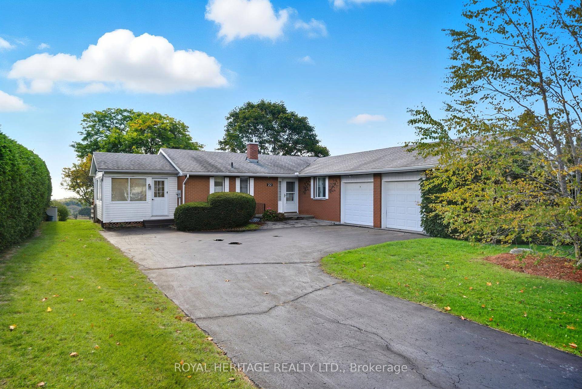 Set on a rare half acre lot in town, this exceptional bungalow offers total privacy and sweeping south facing views over Lake Ontario and the village below.