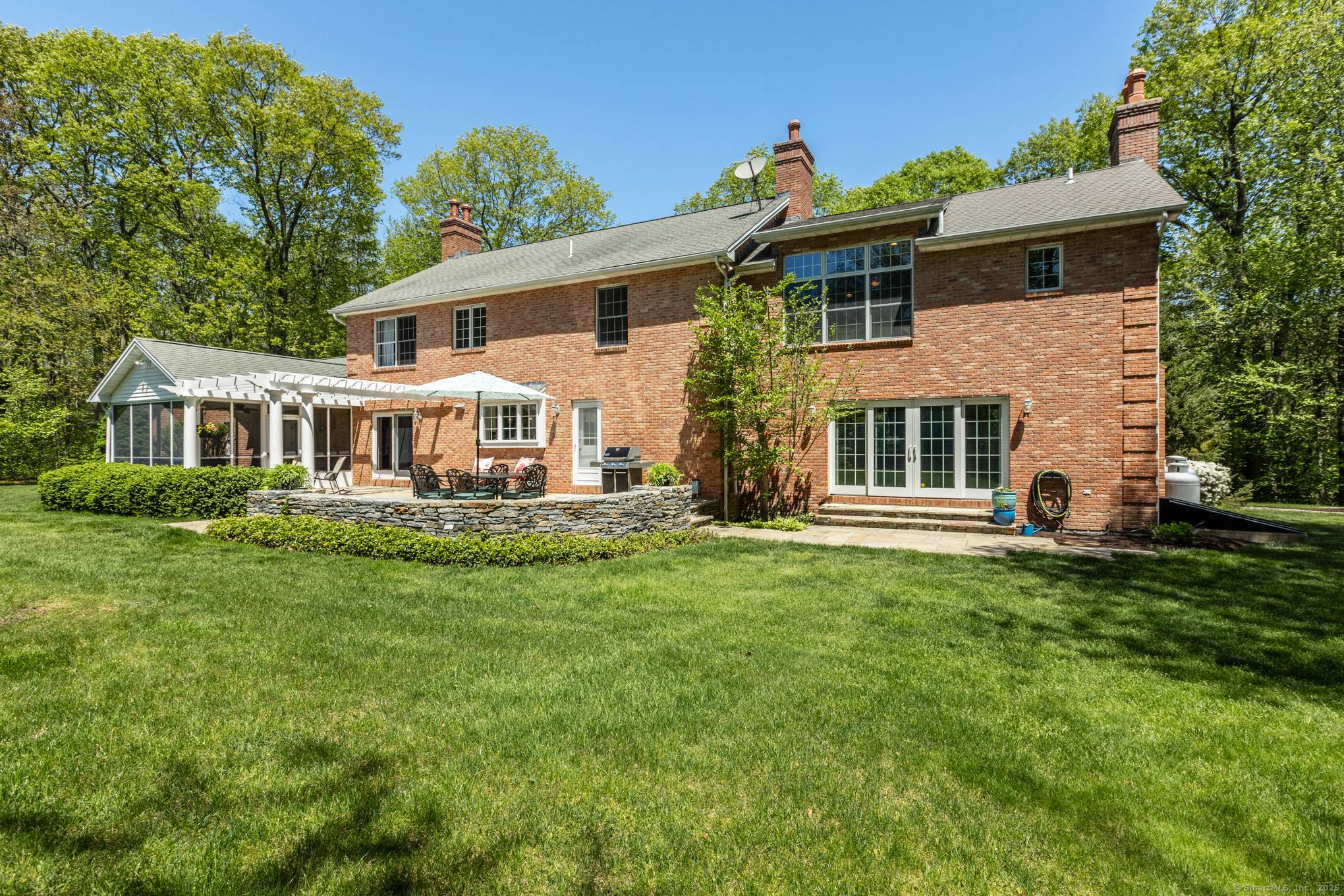 Timeless Elegance Meets Storybook Charm Experience the grandeur of this custom built Grande Colonial, designed by architect Garth Meehan.