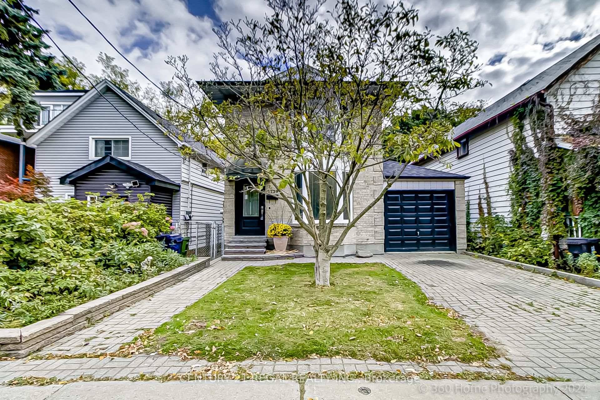 Welcome to this exquisite all brick detached home, featuring private parking and an attached garage.