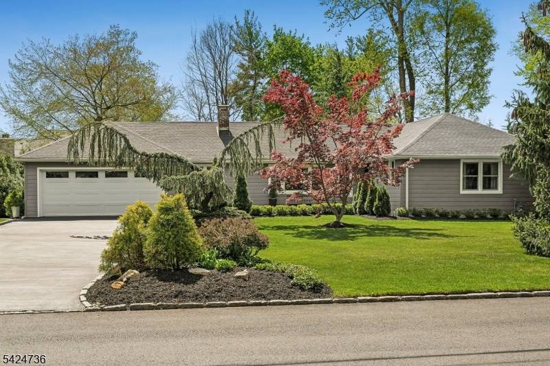 Welcome to elevated Ranch living, masterfully designed for entertaining.