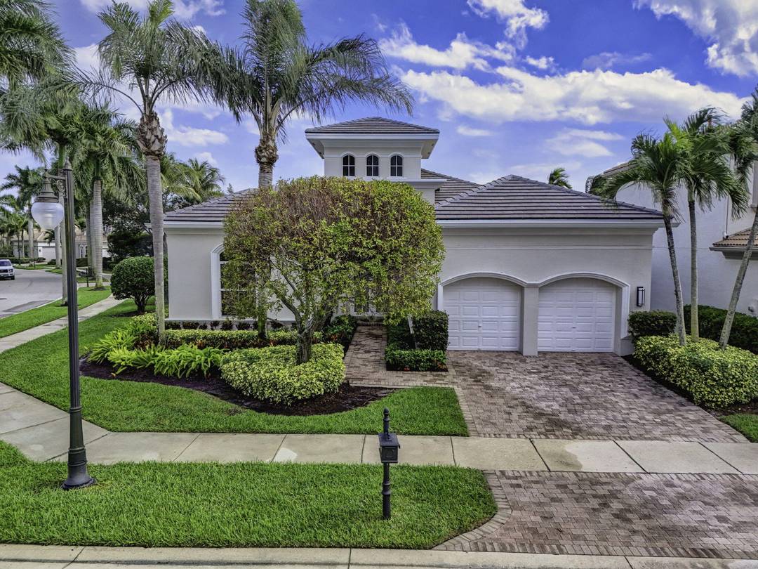 Exciting Country Club at Mirasol home with golf membership, set on an oversized, professionally landscaped cul de sac lot.