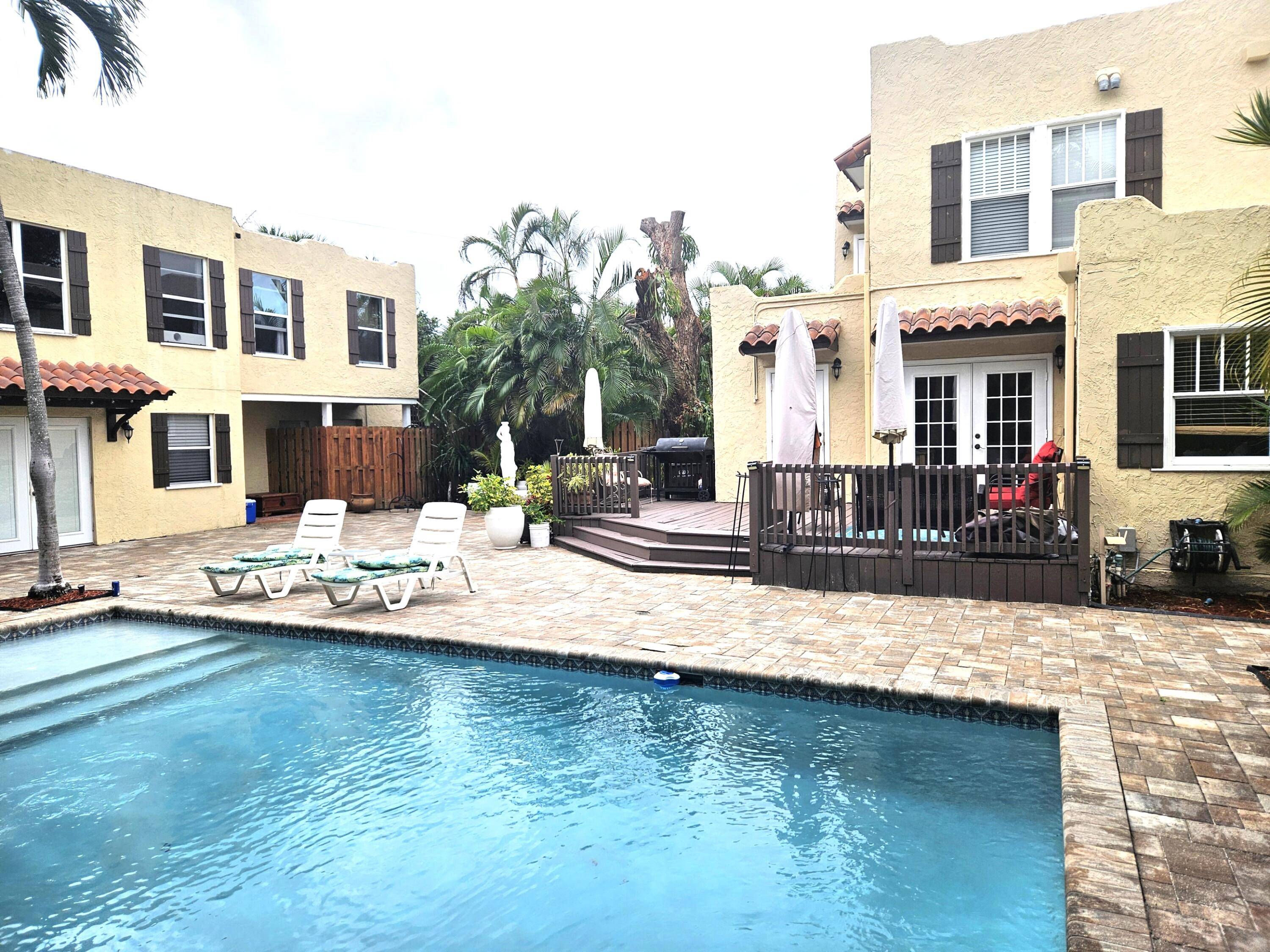 Steps from the Intracoastal, this 1925 estate in Southland Park blends historic charm with modern luxury.