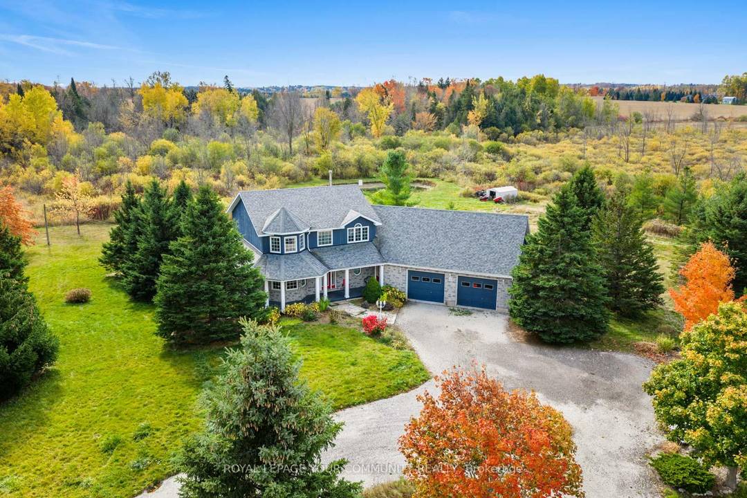 Sitting on over 5 acres of private land, this custom built estate spans more than 3, 000 sq.