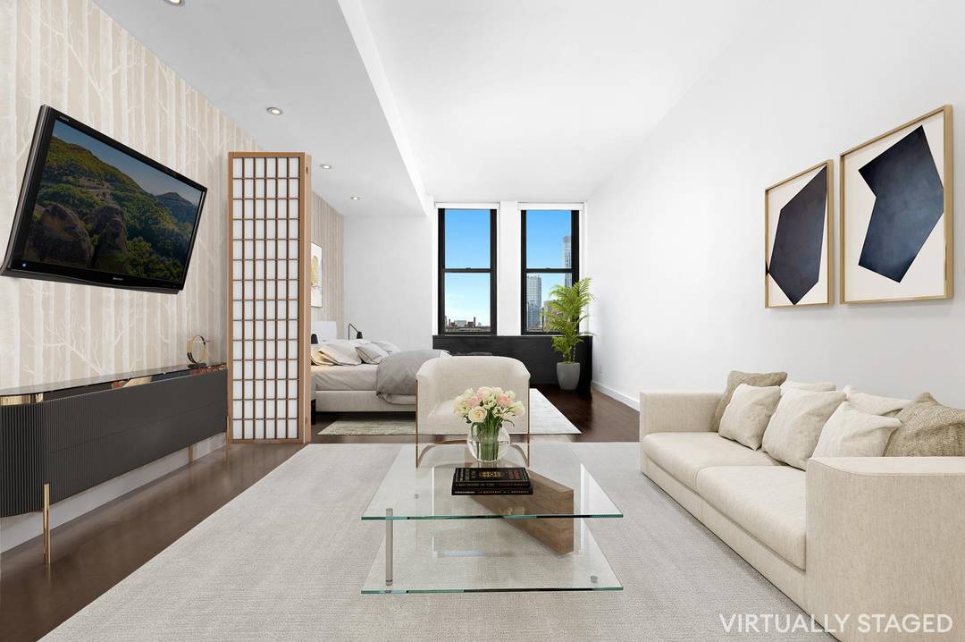 Take advantage of extremely low monthlies with this enormous, high floor view studio loft at Kheel Tower.