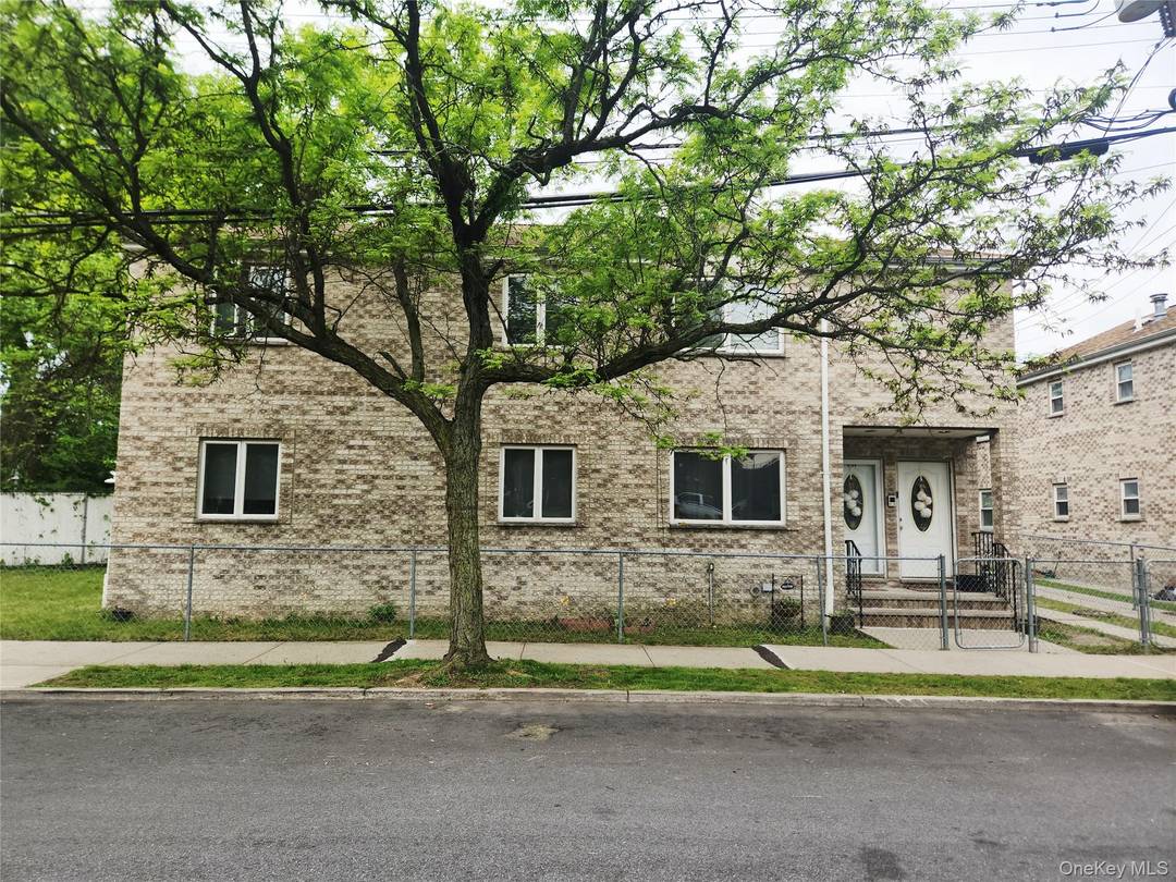 This Extra Ordinary Beautiful BRICK DETACHED Two Family corner home is located on a block with just another existing detached home.