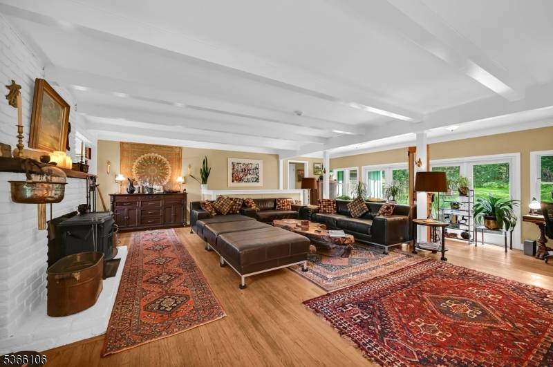 Retreat to this serene and spacious ranch style home, privately nestled on 29 acres of pristine, wooded land.