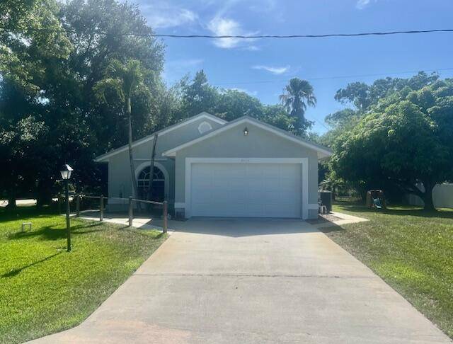 COMPLETELY RENOVATED 2 2 WITH SCREEN ENCLOSURE AND AIR CONDITIONED GARAGE.