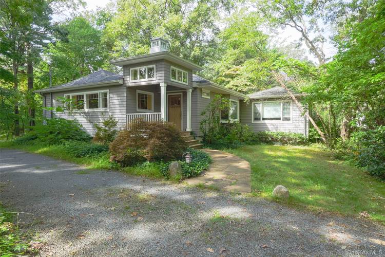 Stunning expanded ranch in a beautiful amp ; desirable neighborhood of Northport, set on a private wooded lot.