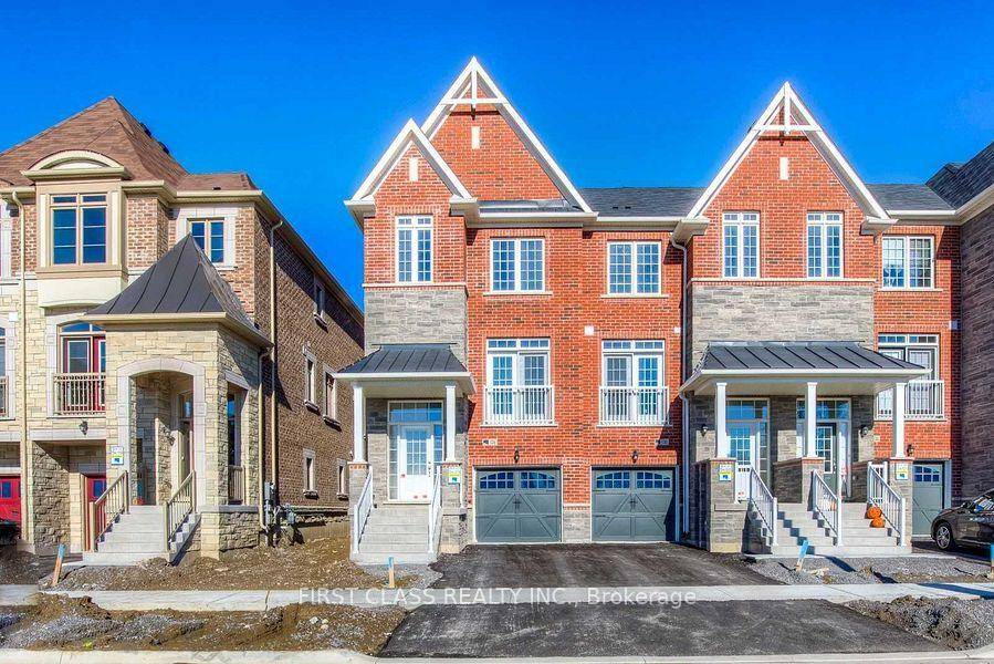 End Unit Freehold Townhome with A deep lot.