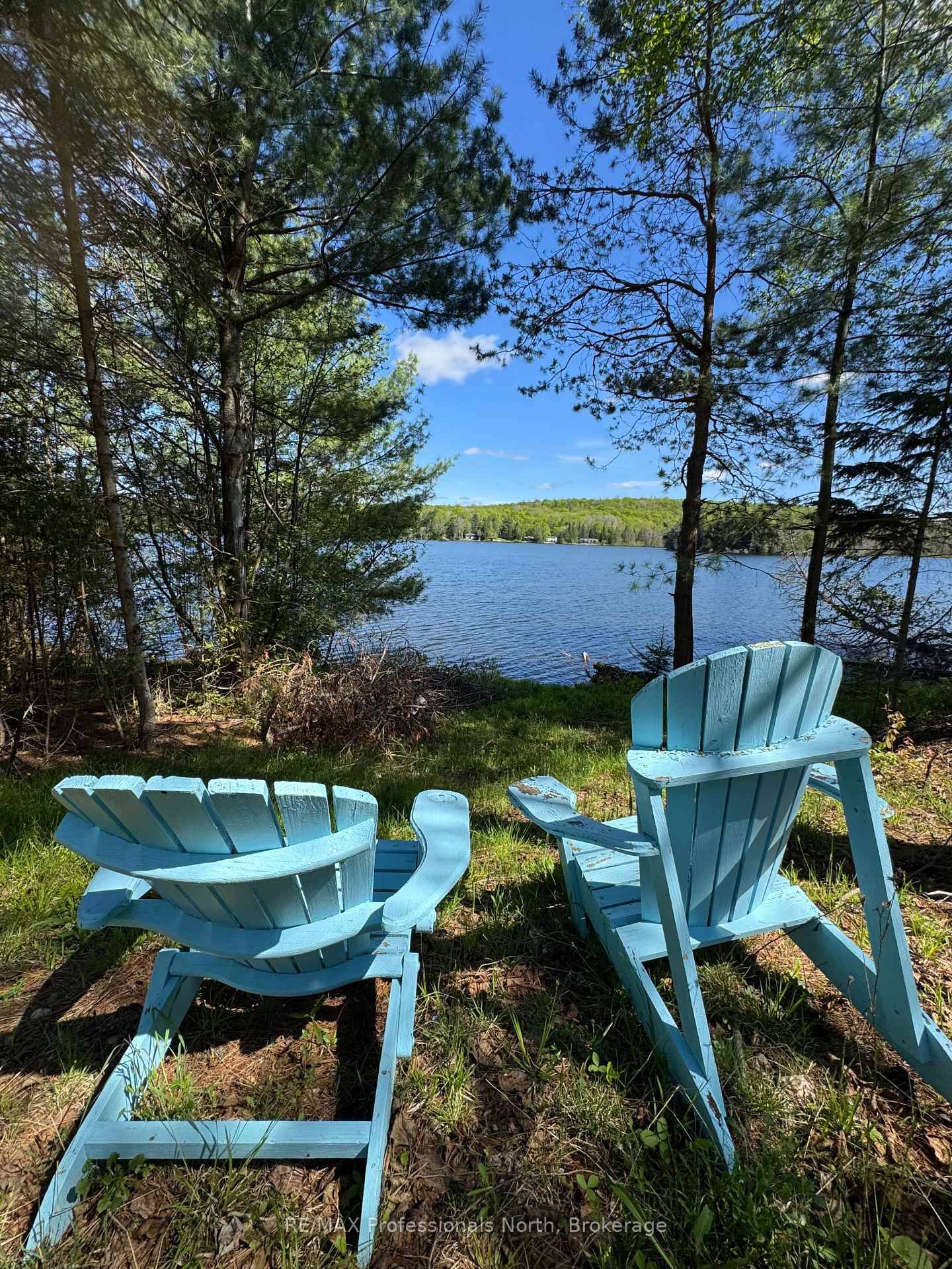Welcome to your ideal building lot on the serene shores of Paradise Lake aka Haas Lake.