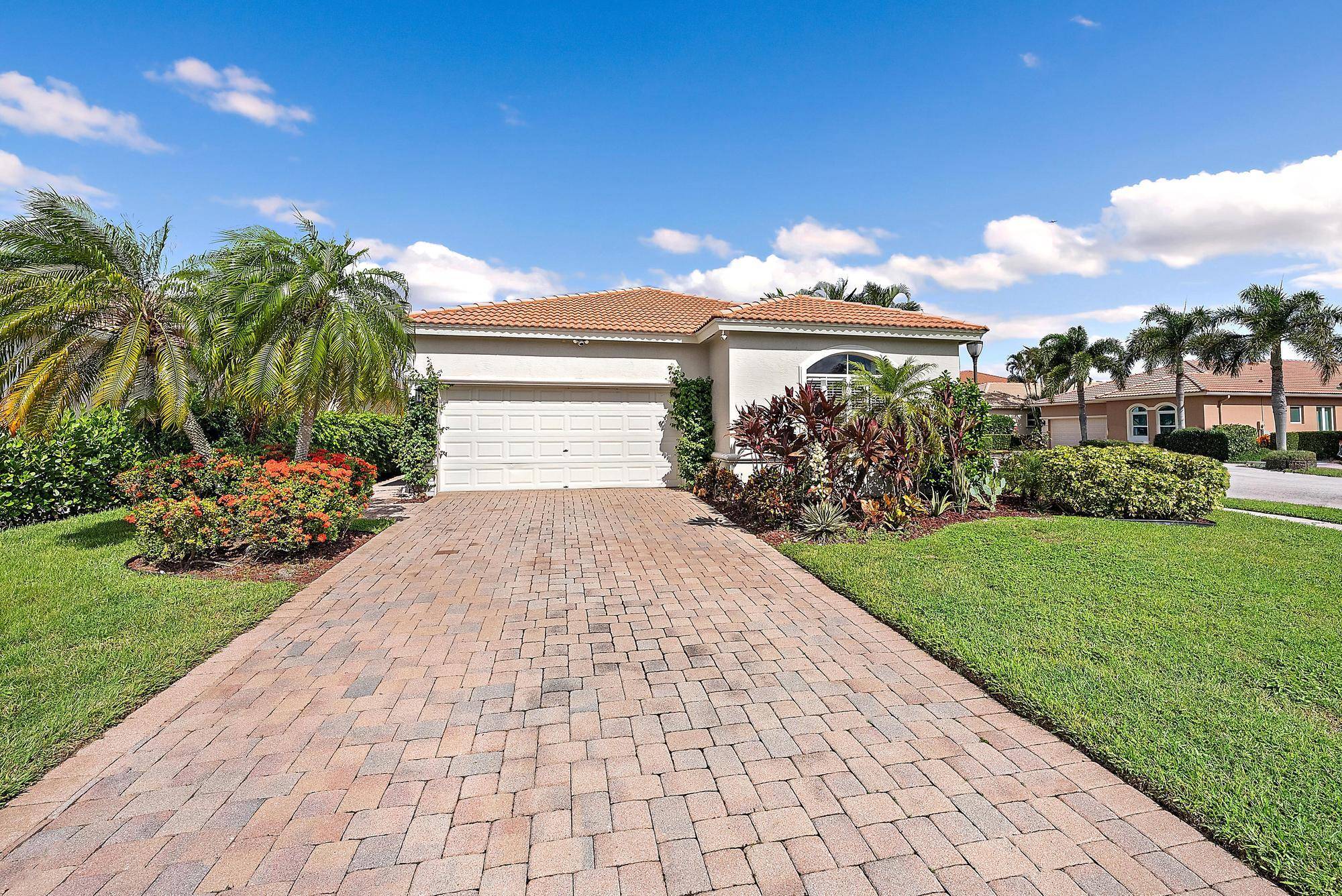 Live in a prime Palm Beach Gardens location within the sought after gated community of Mirabella.