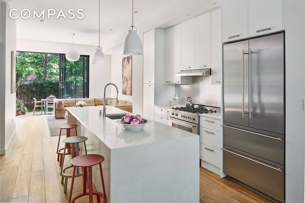 This expansive four story, single family townhouse is a masterpiece of design, comfort, and connection.