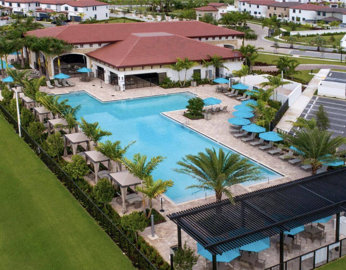 Built in 2021, this impeccable home is located in the gated community of Aquabella !