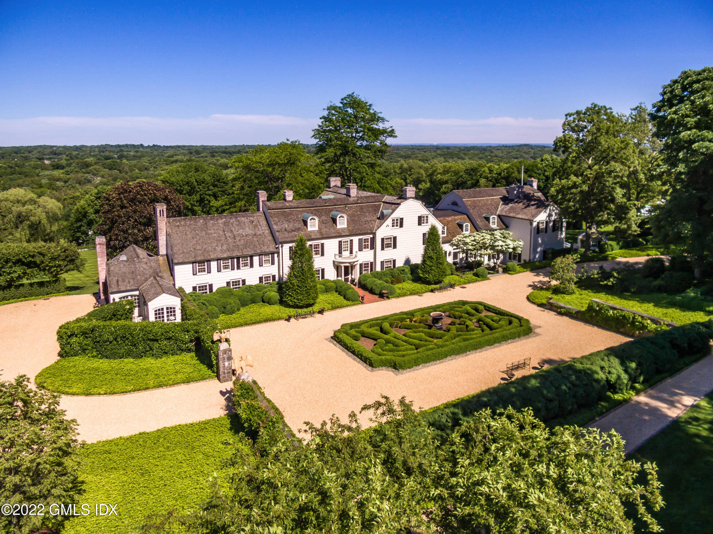 DENBIGH FARM Hilfiger's quintessential English county estate with breathtaking panoramic views of LI Sound sitting high above sea level.