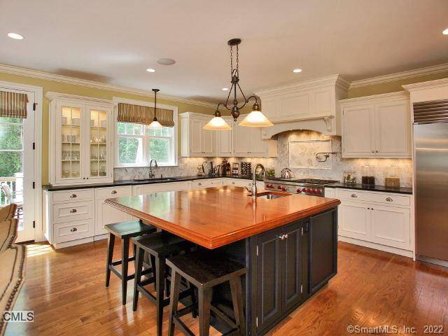Beautifully designed for effortless living, this light filled and airy home at 20 Grassy Plains blends luxury, comfort, and convenience in one exceptional offering.