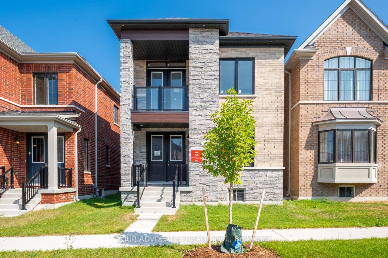 This brand new pre construction detached home features an open concept kitchen with breakfast area and family room that opens onto a covered porch and outdoor amenity space.
