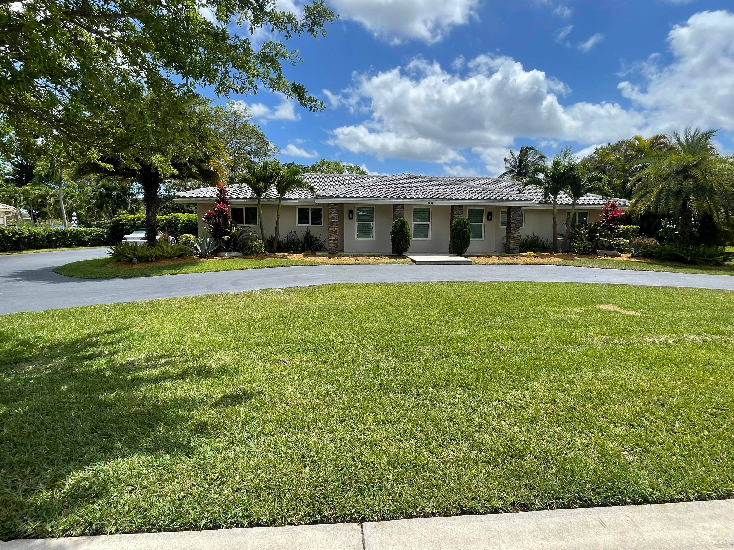 Simply amazing, completely updated 4 bedroom 2 bathroom waterfront pool home located on over 15, 000 sqft lot located Coral Springs Country Club no HOA.