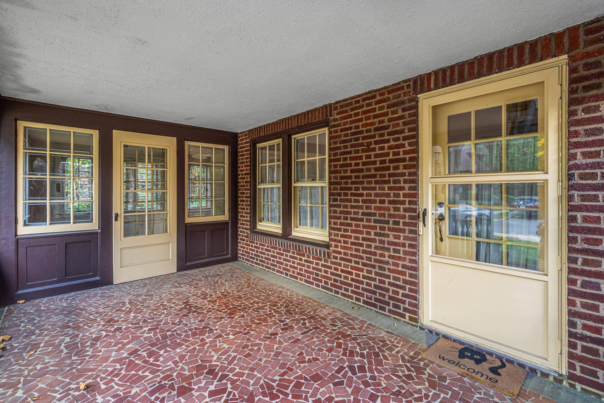 Welcome to 12 Middlemay Circle a captivating semi attached Tudor nestled on one of the most picturesque streets in Forest Hills Gardens.