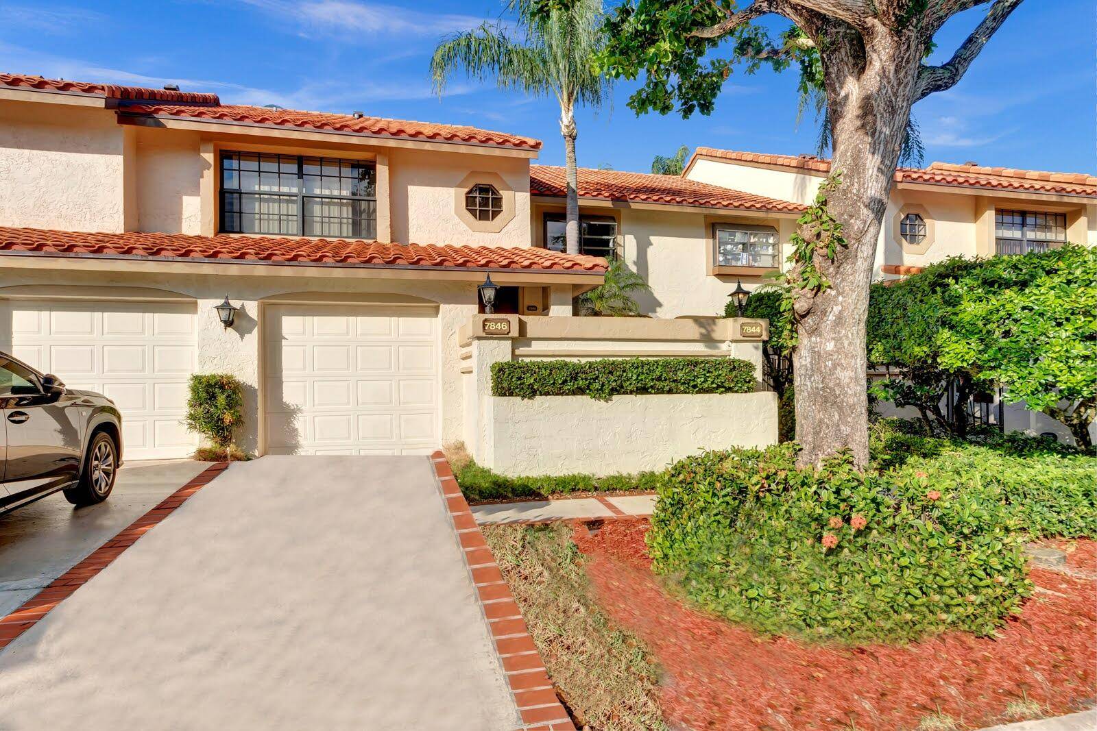 GORGEOUS 1st Floor NO STAIRS home with 2 Beds 2 Baths with NEW PORCELAIN TILE THROUGHOUT, NEW BATHROOMS NEW AC INSTALLED IN 2024 !