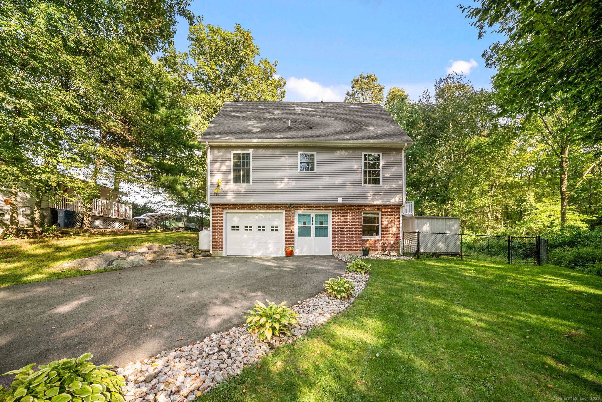 Welcome to 214 Camp Moween, a rare opportunity to own direct waterfront on the peaceful shores of Red Cedar Lake in Lebanon, CT.