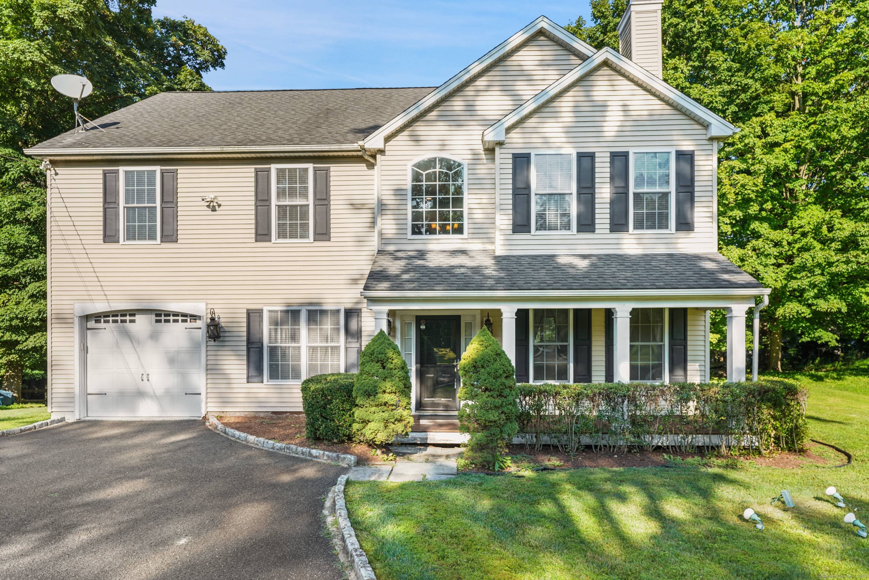 Set on beautifully manicured grounds in a coveted enclave, this four bedroom Colonial offers timeless architecture elevated finishes designed for comfort modern distinction.