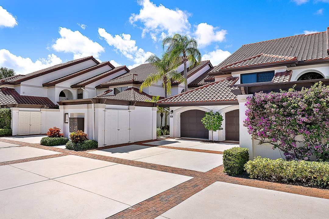 Enjoy serene lakefront views from this beautifully updated ground floor 2 bedroom, 2 bathroom condo in the gated community of Jonathan's Landing.