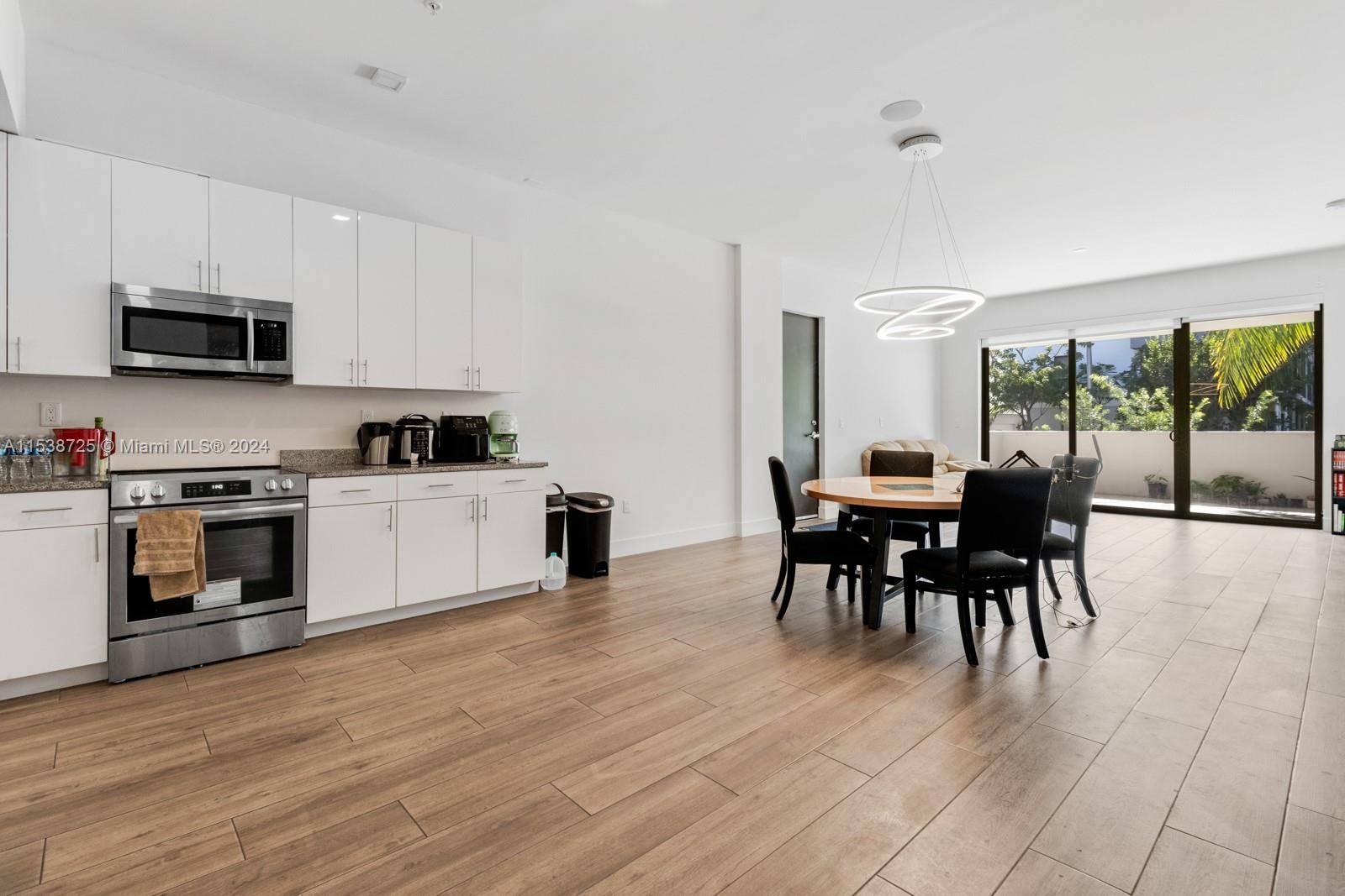 1, 834 SQFT LIVING AREA BEST PRICE PER SQFT FOR A NEW CONDO IN THE GROVE STUNNING 3 BED, 3.