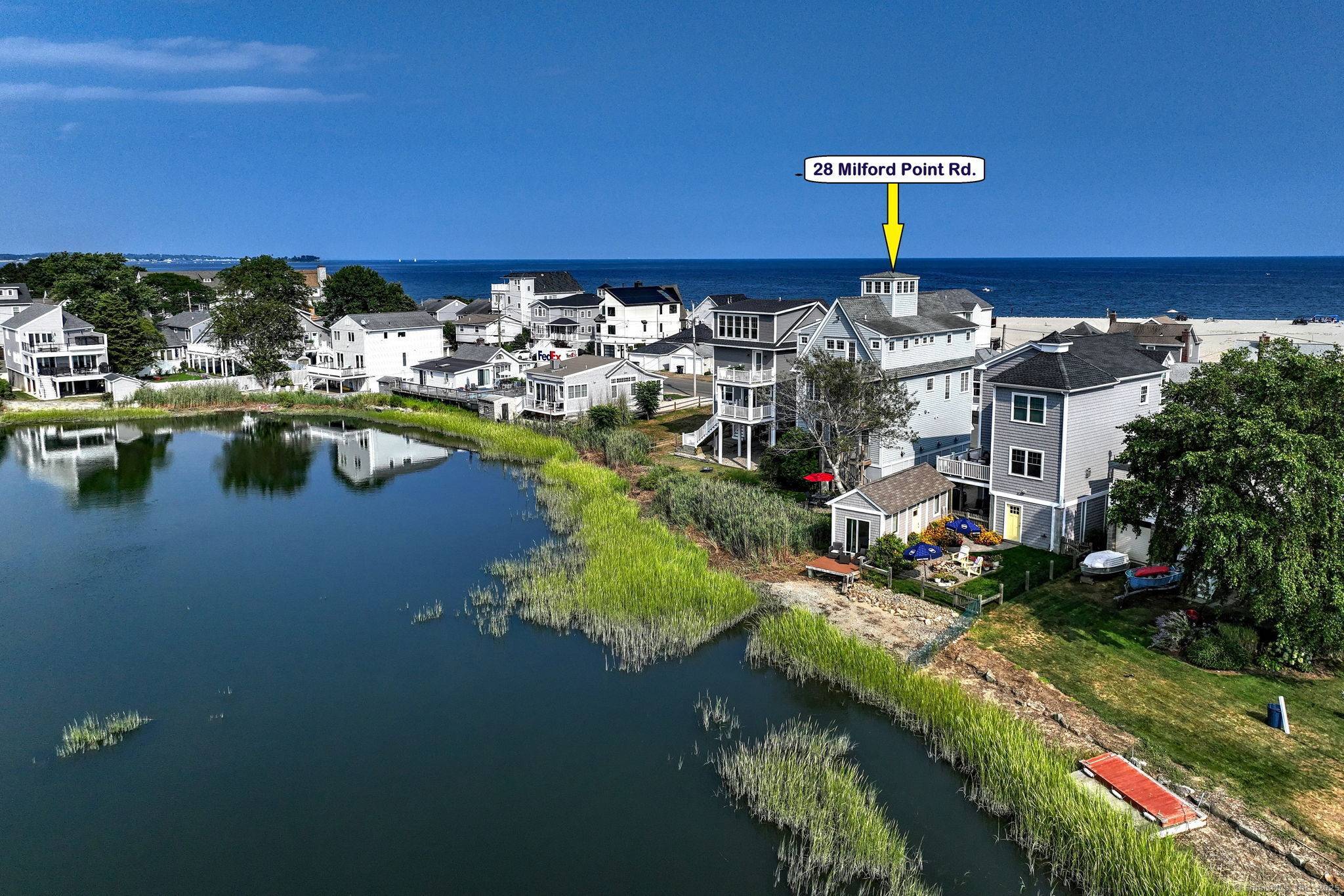 DIRECT WATERFRONT CEDAR BEACH, MILFORD Welcome to an exceptional opportunity to live by the water in comfort, style, and tranquility.