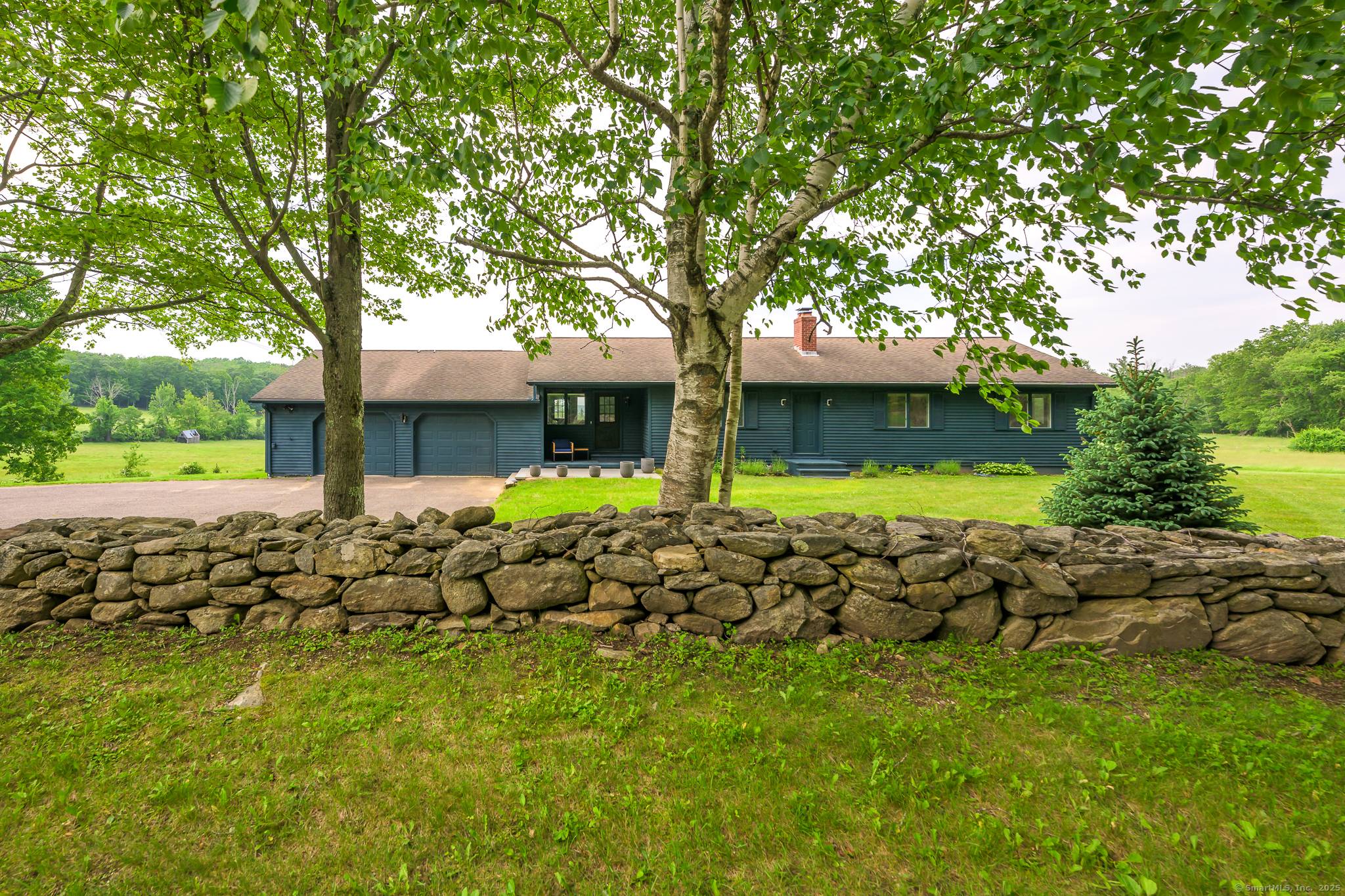 Experience serene, one level living at its finest in this newly renovated ranch home located in an exceptional rural setting.