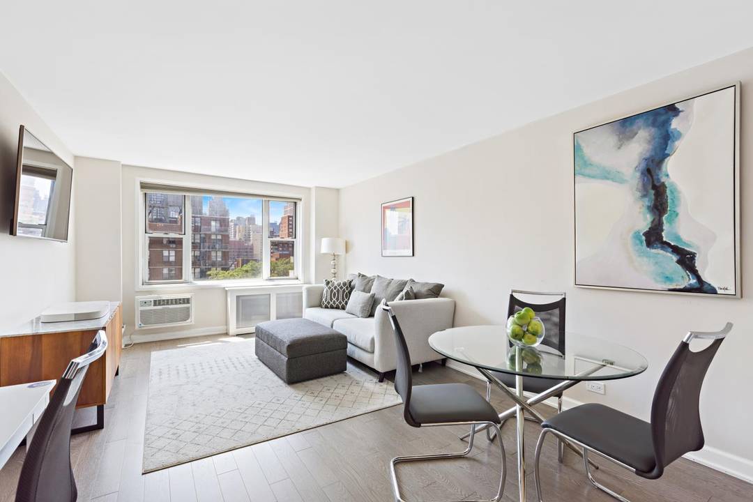 Sunlit and renovated high floor one bedroom apartment with open south facing city views in the heart of the Upper East Side.