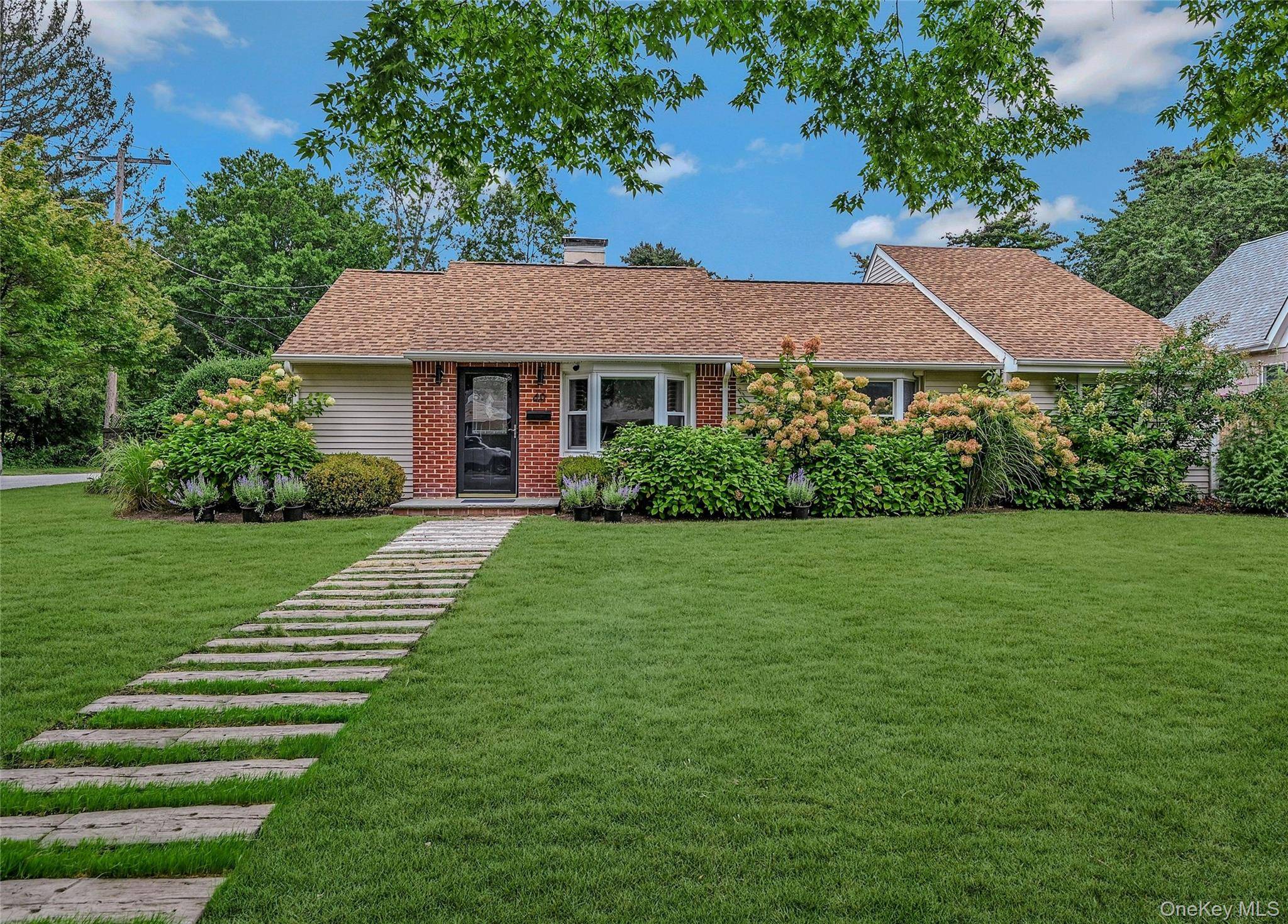 This exceptional 4 bedroom ranch, located just west of vibrant Huntington Village, is designed with inspiration and flair.