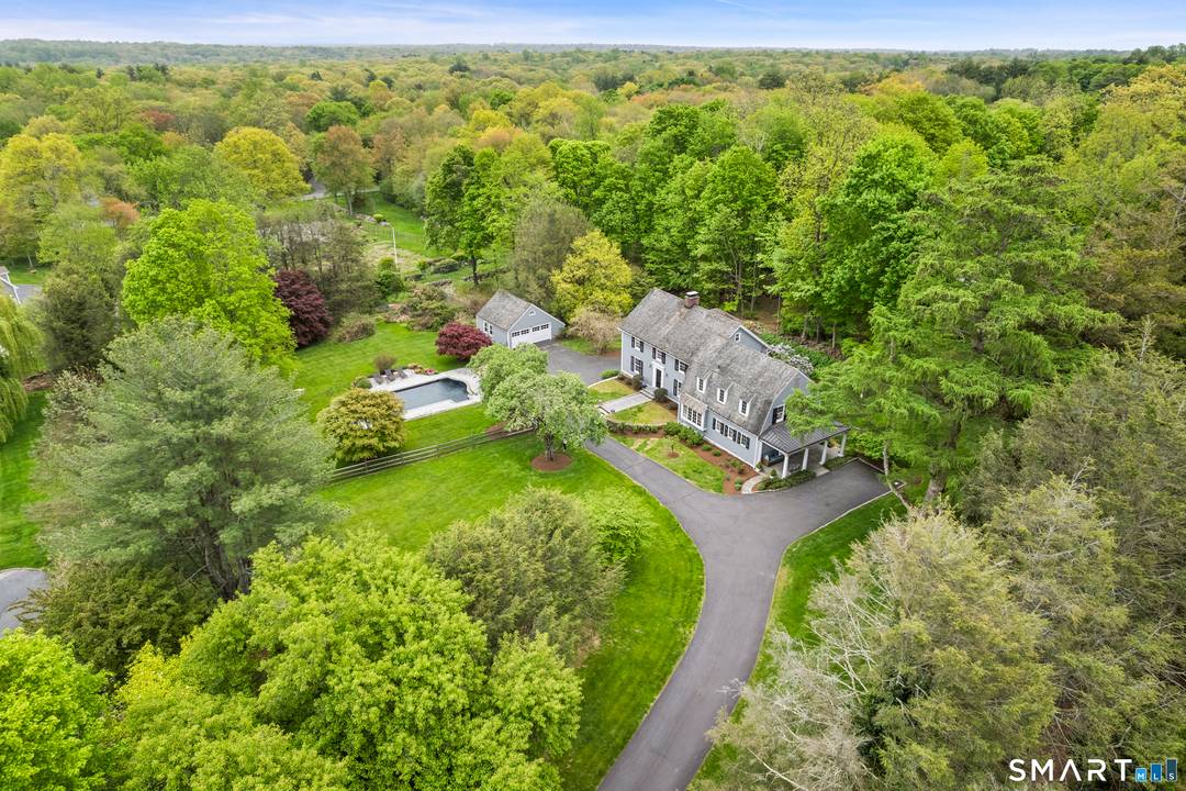 176 Carter Street is a rare retreat tucked down a quiet lane on nearly two park like acres surrounded by mature specimen trees, perennial gardens, and sweeping open lawns.