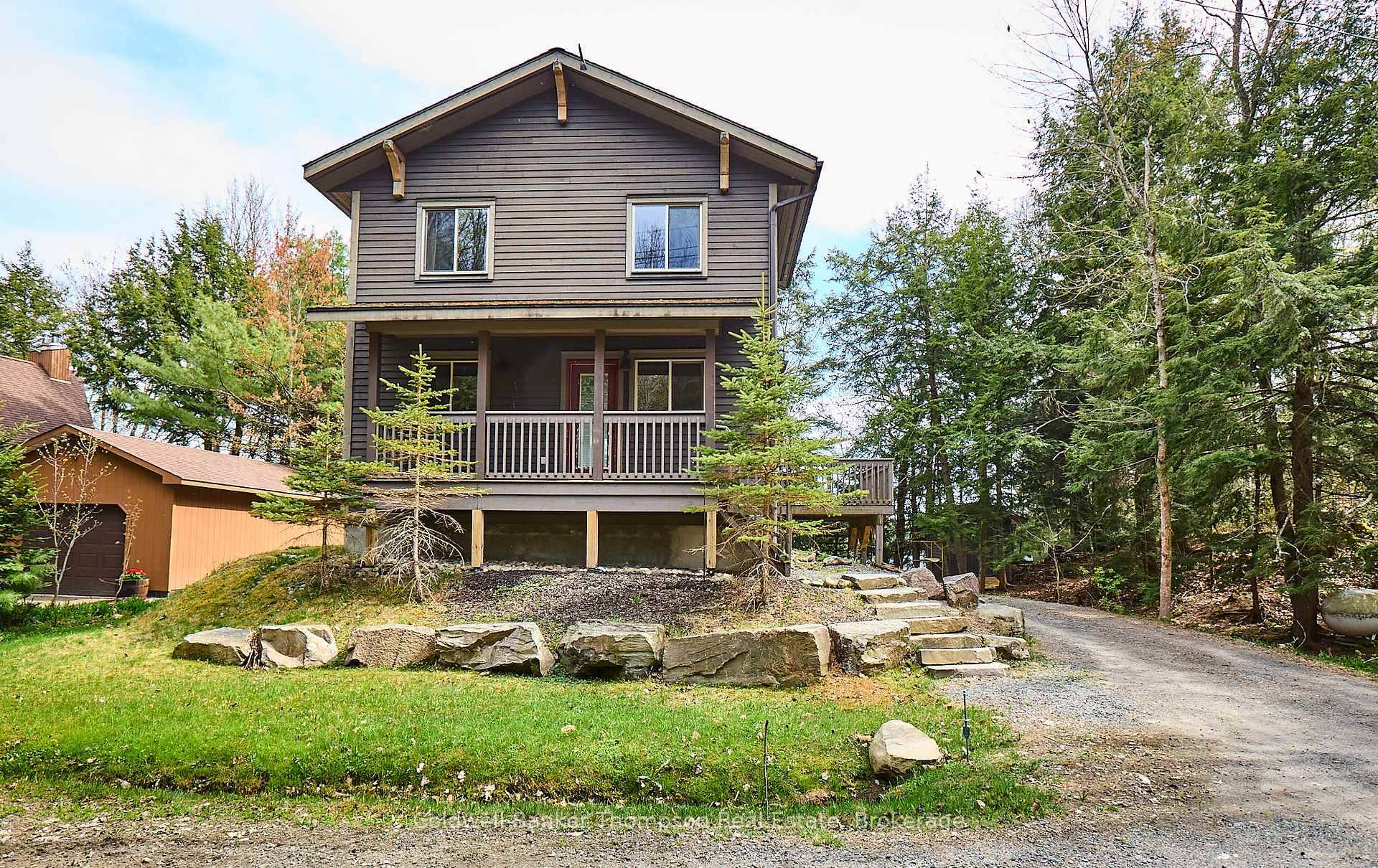 Located steps from the serene shores of Chub Lake and accessed via a quiet, year round private road, this charming Craftsman style retreat by Linwood Homes awaits.
